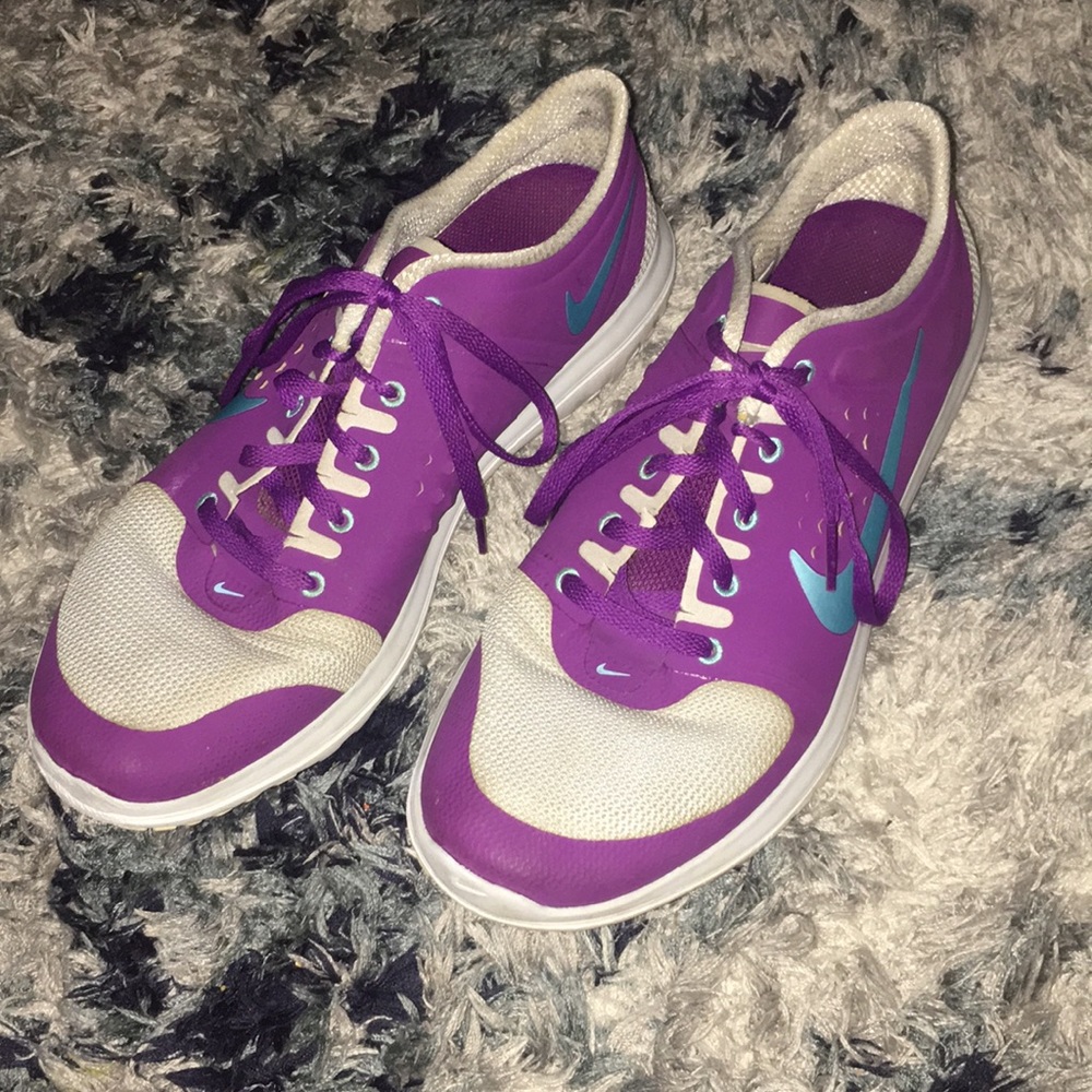 Purple, gray and teal Nike running shoes